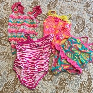 Bundle of four bright pretty swimsuits. Perfect condition. Size 18 to 24 months